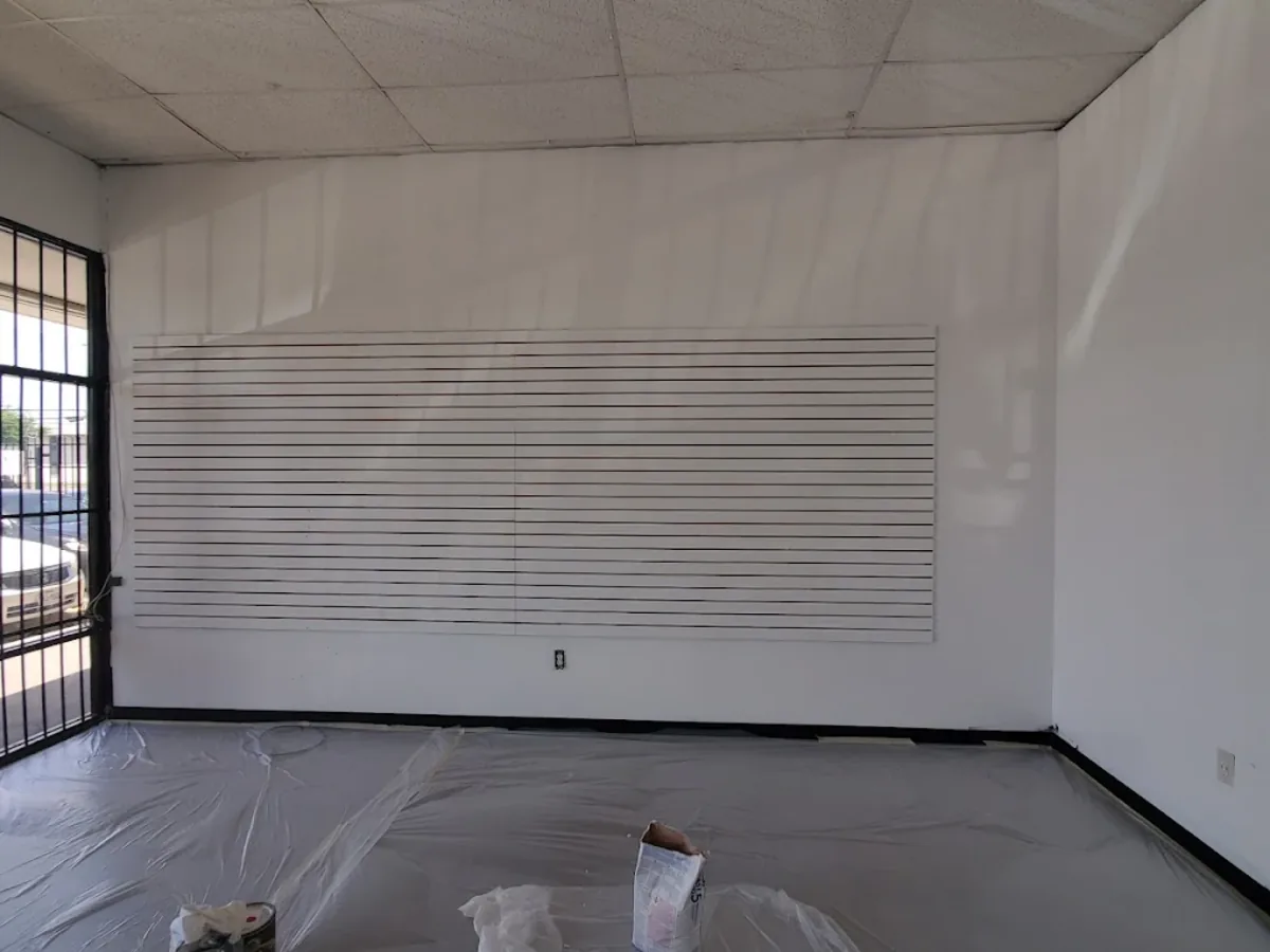 Garage interior painted white with a slat accent wall